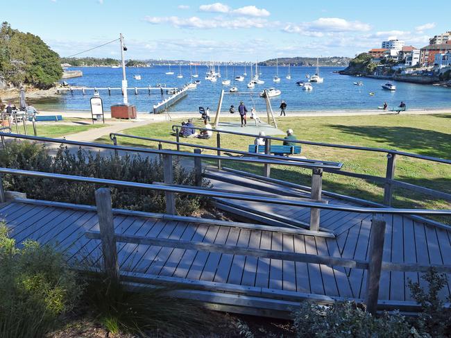 In 2017, Northern Beaches Council planned to create a boardwalk over the sand in front of homes, dividing the park. Pictured is the boardwalk leading to the park and beach at Little Manly. Picture: Troy Snook.