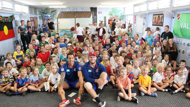 Mitchell Pearce and Lachlan Fitzgibbon with the kids at Gillieston Primary School.