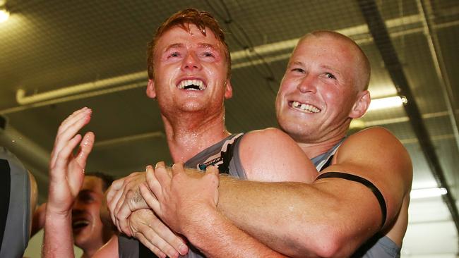 Port Adelaide’s Willem Drew of the Power (L) celebrates the win with teammate Tom Clurey after the Round 1 round win against Melbourne Demons at Melbourne Cricket Ground. Picture: Michael Dodge/Getty Images.