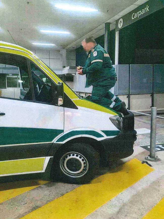 An ambulance officer allegedly chalking a vehicle with protest messages. Picture: State Government