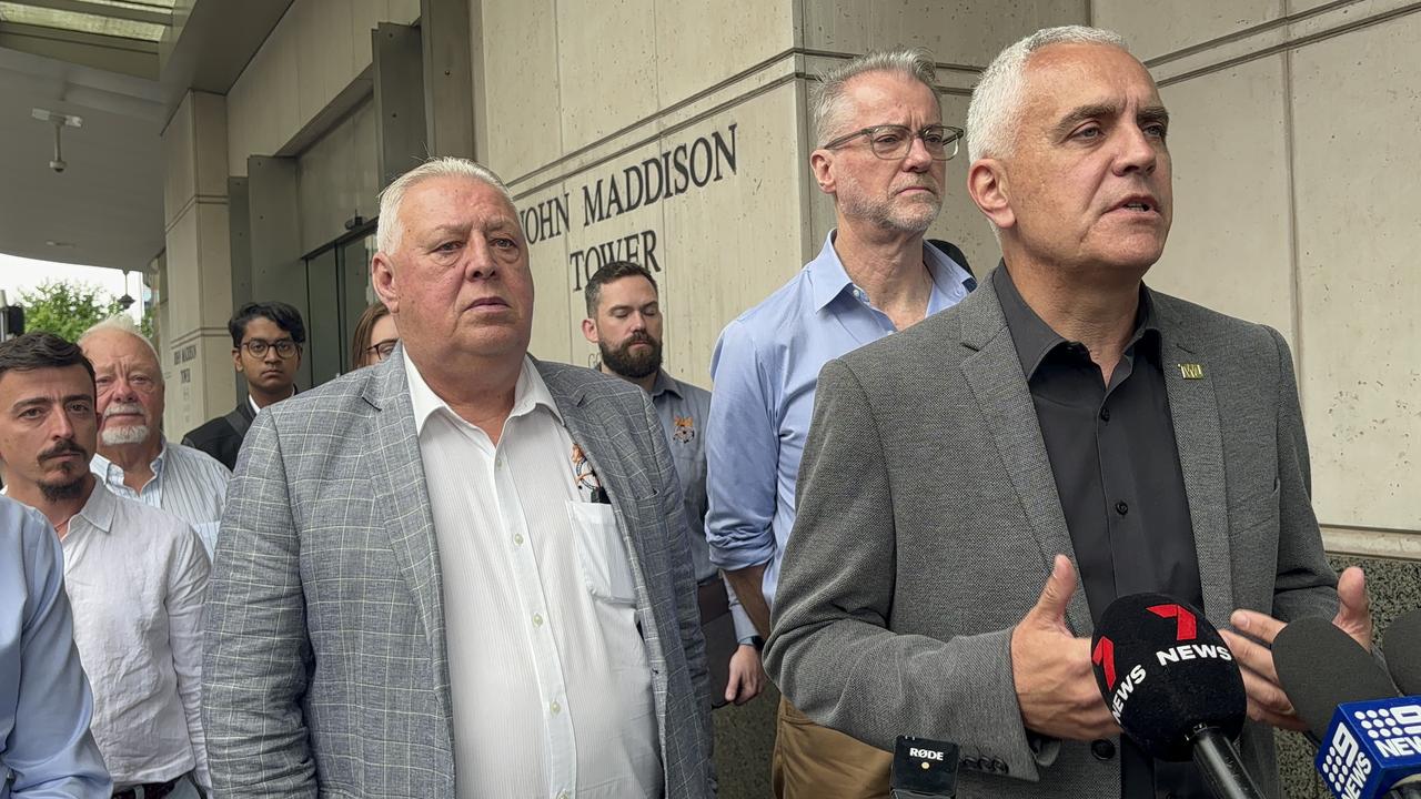 TWU national secretary Michael Kaine speaks to the media with members of the union behind him. Picture: NCA NewsWire