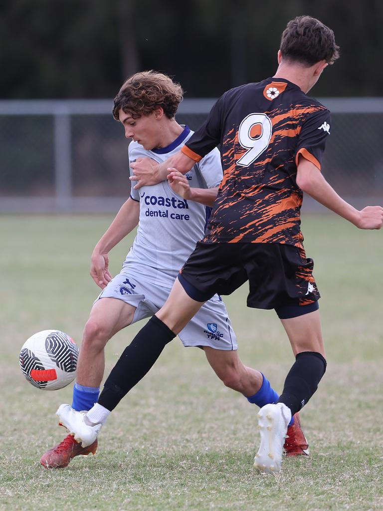 Premier Invitational Football 2024 tournament at Glennon Park Nerang. Field 2...Magic Utd (grey) V Football NT Utd. Picture Glenn Hampson