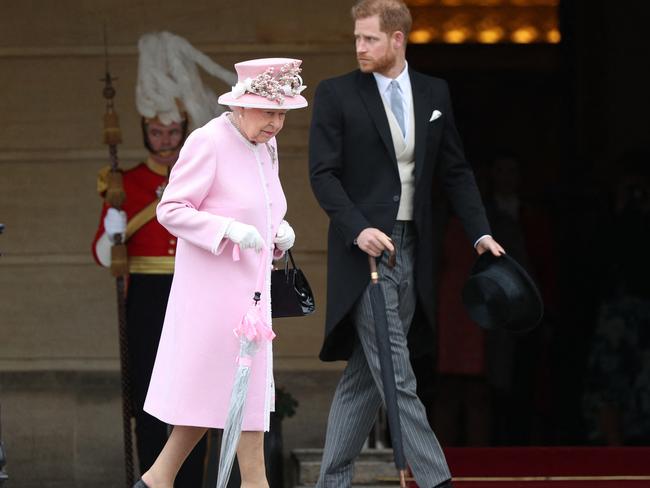 Queen Elizabeth II and Prince Harry at the Queen's Garden Party in Buckingham Palace in 2019. Sources confirmed he phoned Her Majesty to ask permission to name the baby after her. Picture: AFP