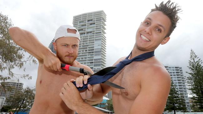 Cutting Gold Coast Ties Mathew Scully of Burleigh and Callym of Isle of Capri pictured at Broadbeach cutting off a neck tie. They welcome Cr Crichlow’s push. Picture Mike Batterham