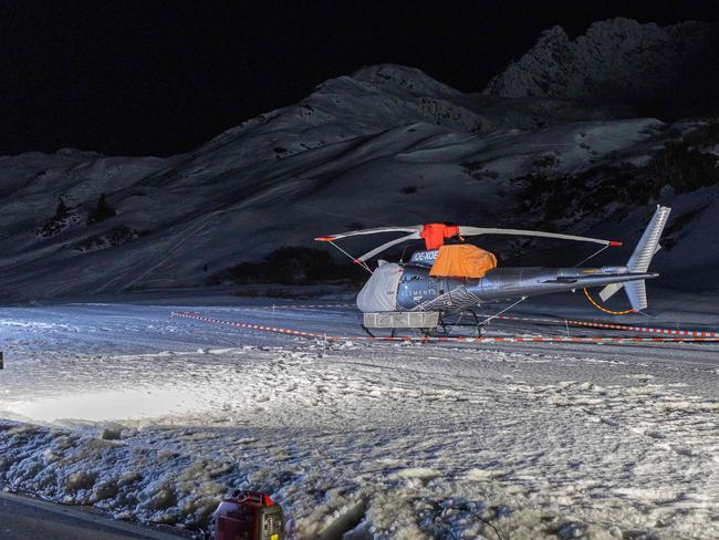 This photograph taken on December 25, 2022 shows a covered rescue helicopter at the ski resort of Lech Zurs after an avalanche allegedly caused the death of at least ten skiers in Zurs, eastern Austria. (Photo by Peter RINDERER / EXPA / AFP) / Austria OUT
