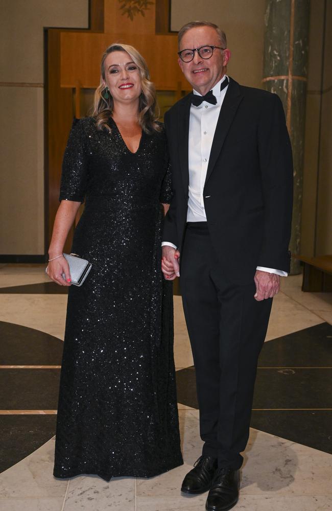 PM Anthony Albanese and his partner Jodie Haydon hold hands as they arrive at the Midwinter Ball at Parliament House in Canberra. Picture: NCA NewsWire / Martin Ollman