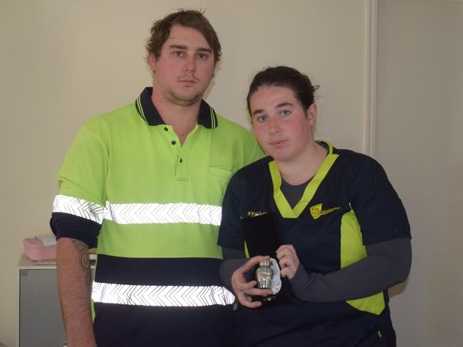 Natasha Tacon and Braeden Carolan holding their baby boy's urn. Picture: Aden Stokes