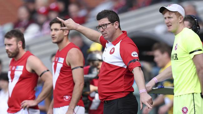 North Adelaide coach Josh Carr directs his players from the interchange bench on Sunday. Picture: Sarah Reed