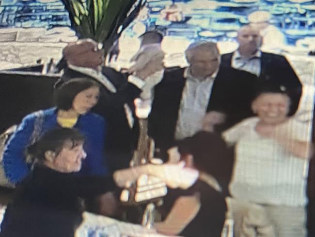 Peter Dutton, Frank Carbone and Dai Le meet at Candelori's restaurant in Smithfield. Dutton was left holding the baby.