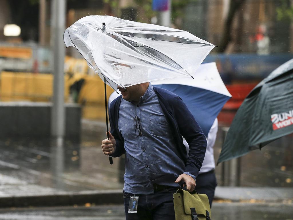 Heavy rain and wind hits Circular Quay as Sydney endures bad weather. Picture: Dylan Robinson