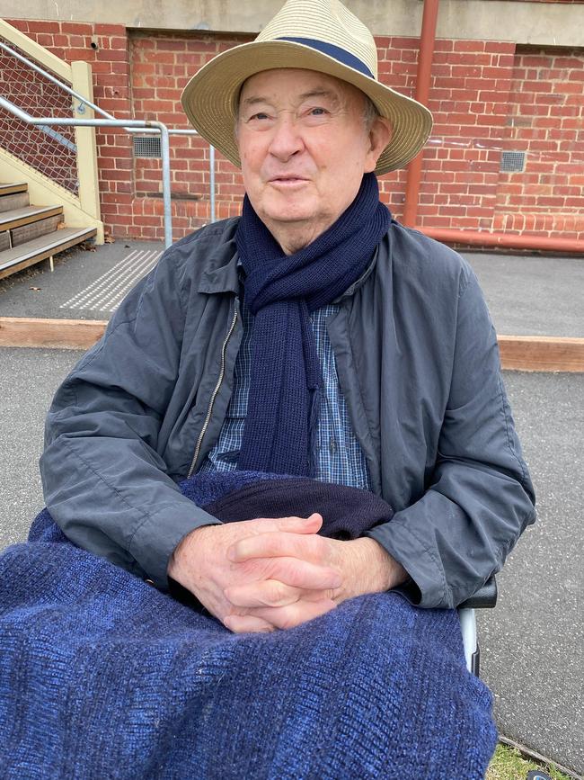 Legendary Prahran administrator David Jukes watches play.