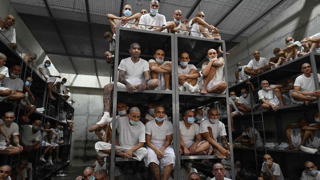 Inmates remain in a cell at the Counter-Terrorism Confinement Centre (CECOT) mega-prison, where hundreds of members of the MS-13 and 18 Street gangs are being held, in Tecoluca, El Salvador on January 27, 2025. The CECOT, the largest prison in Latin America and emblem of the war against gangs of the government of President Nayib Bukele, celebrates two years since it was inaugurated on February 1. (Photo by Marvin RECINOS / AFP)