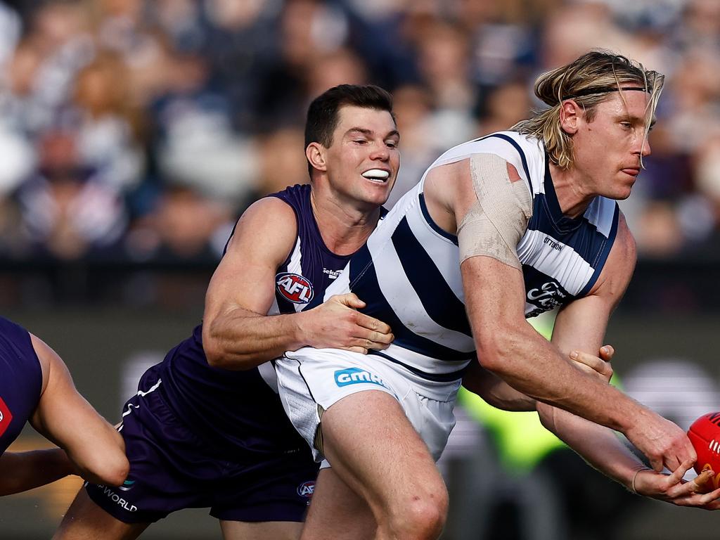 GEELONG, AUSTRALIA - JULY 29: Mark Blicavs of the Cats is tackled by Jaeger O'Meara of the Dockers during the 2023 AFL Round 20 match between the Geelong Cats and the Fremantle Dockers at GMHBA Stadium on July 29, 2023 in Geelong, Australia. (Photo by Michael Willson/AFL Photos via Getty Images)