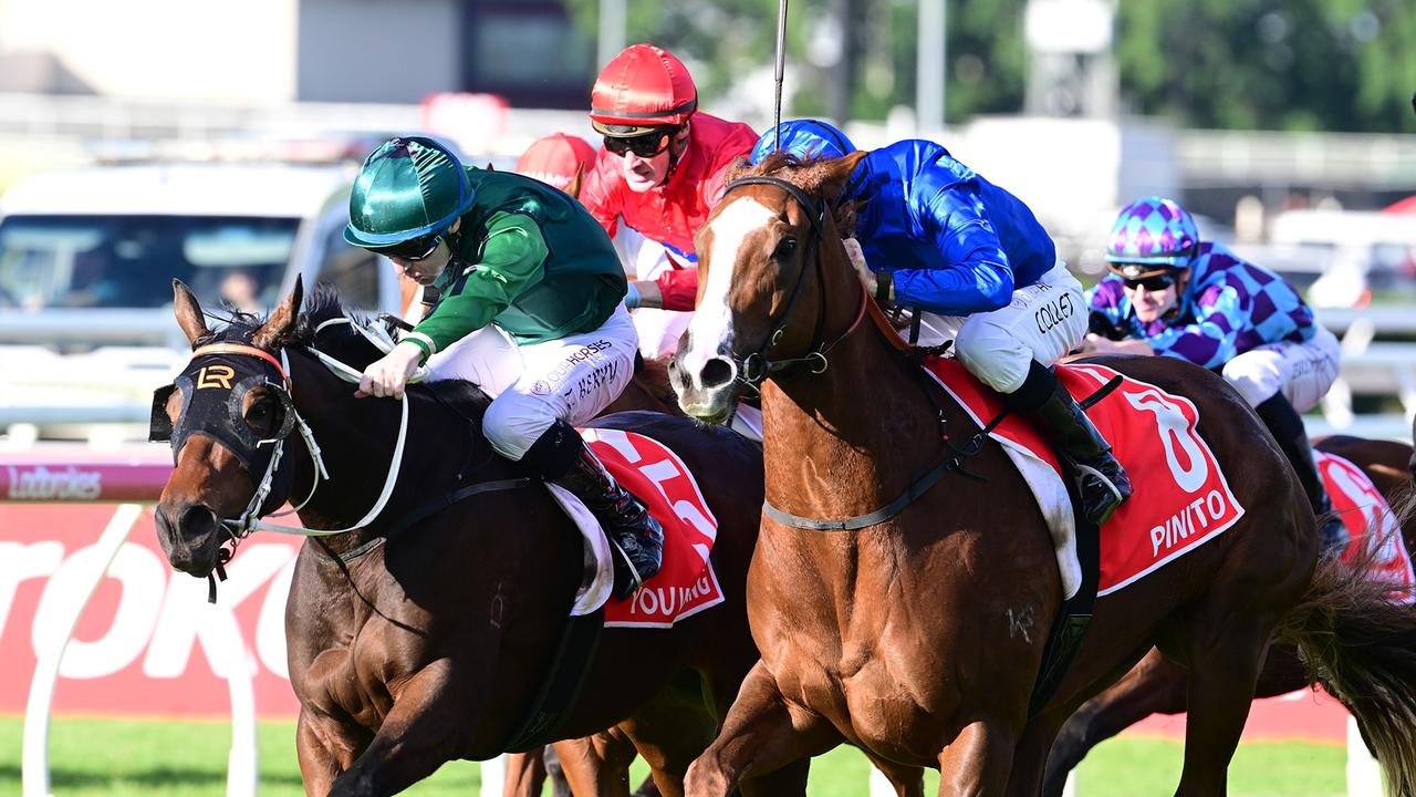 The Glen Thompson-trained filly Benagil (red silks) narrowly misses out in the Group 1 Queensland Oaks at Eagle Farm last Saturday. Picture: Grant Peters, Trackside Photography.