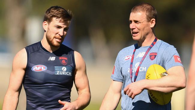 Jack Viney of the Demons speaks to head coach Simon Goodwin during a Melbourne training session at Gosch's Paddock on Tuesday. Picture: Quinn Rooney/Getty Images