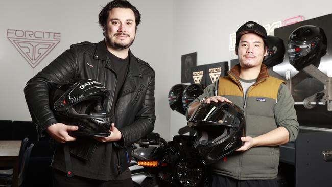 Forcite co-founders Alfred Boyagdis and Julian Chow with their smart motorbike helmets. Picture: Tim Hunter.