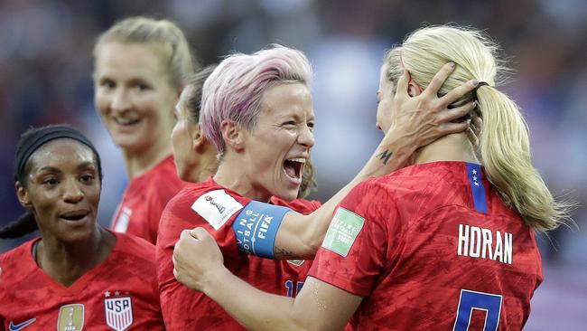 United States' scorer Lindsey Horan, right, celebrates their side's 3rd goal with Megan Rapinoe during the Women's World Cup Group F soccer match between United States and Thailand at the Stade Auguste-Delaune in Reims, France, Tuesday, June 11, 2019. (AP Photo/Alessandra Tarantino)