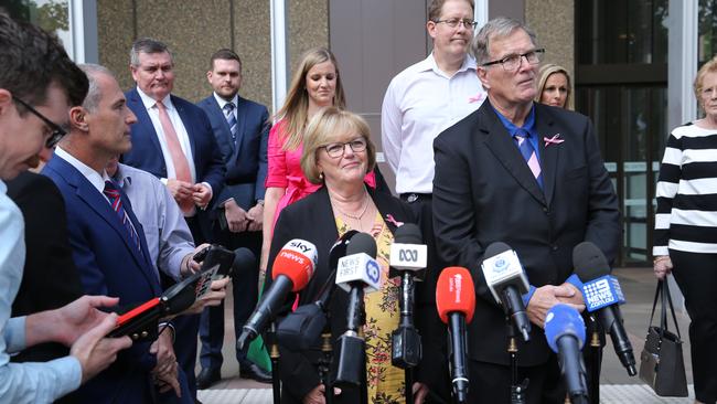 Greg Simms with wife Marilyn and their daughter Renee speak to media outside court after the sentence in handed down. Picture: Britta Campion