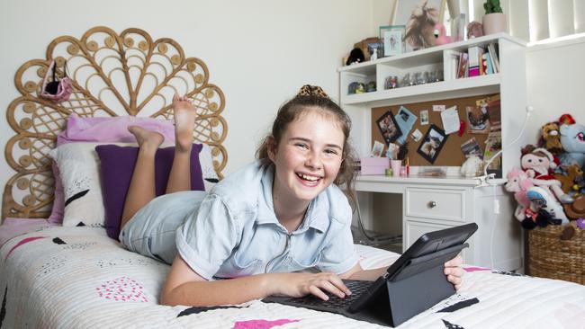 Ever Cunningham takes a break from school work to chill out in her room. Picture: Renae Droop