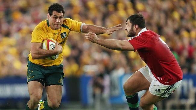 George Smith of the Wallabies takes on the British &amp; Irish Lions defence in 2013.