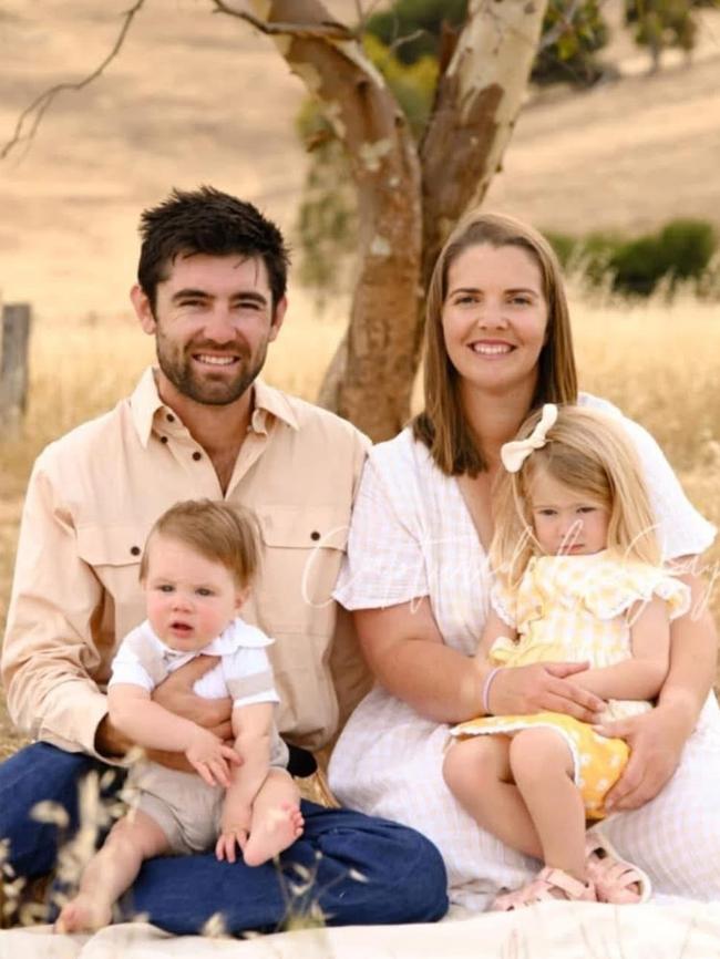 Cameron Bond, 29, who has been diagnosed with stage 3c bowel cancer, with his family, partner of five years Jessica Theobald and children two-year-old Eliza and nine-month-old Clancy. Picture: Supplied