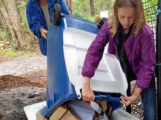 COMPOST: Sunshine Beach Primary School environmental leader Amelie adding to compost bins after the school's recent International Food Fair. Picture: Contributed