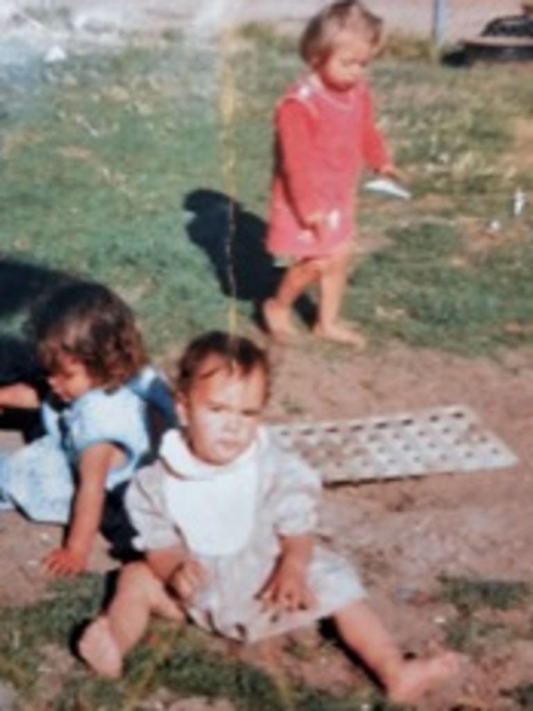 Eddie Betts as a baby with cousins Ella in the blue and Sherema in the red, featured in the book The Boy from Boomerang Crescent. Picture: Supplied