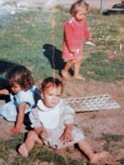 Eddie Betts as a baby with cousins Ella in the blue and Sherema in the red, featured in the book The Boy from Boomerang Crescent. Picture: Supplied