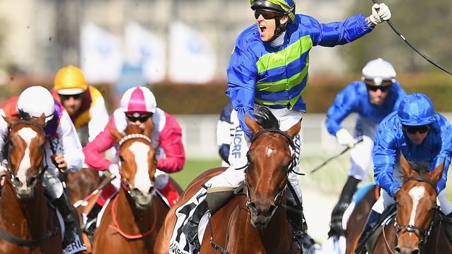 Nick Hall punches the air after riding Jameka to victory. It was Hall’s second Caulfield Cup win.