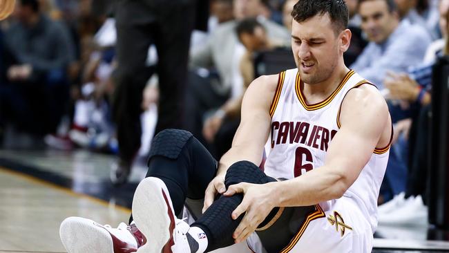 Andrew Bogut #6 of the Cleveland Cavaliers reacts after breaking his leg