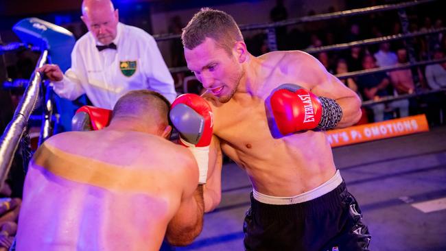 Toowoomba's Steve Spark lands a shot on Kieran Cronin.