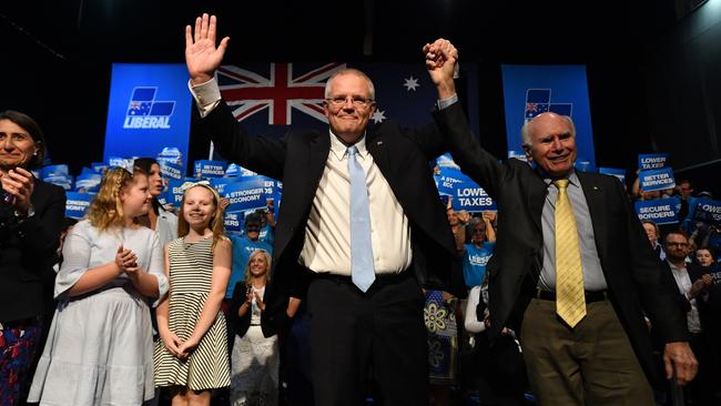 Prime Minister Scott Morrison and former prime minister John Howard at the campaign rally at Sydney Olympic Park yesterday. Picture: AAP 