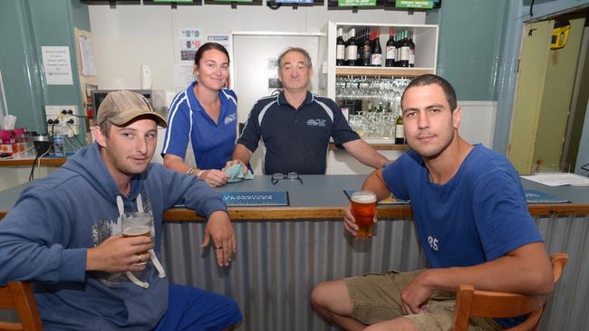 Locals and staff enjoying a drink and the town's new-found fame at the Dunedoo Hotel.