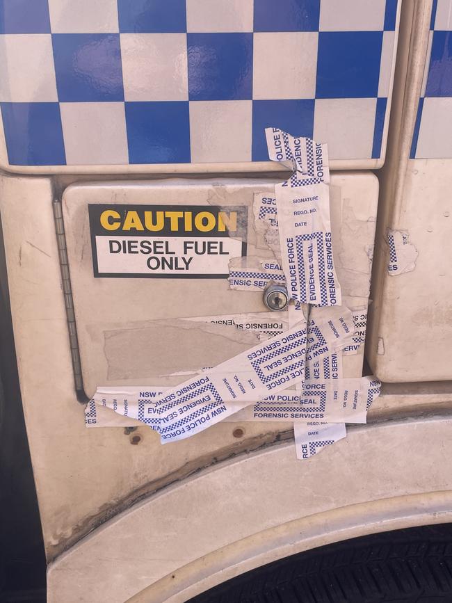 The cop car held together by evidence tape outside Waverley Police Station.