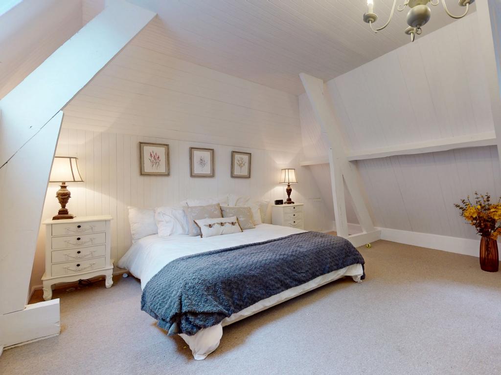 One of the property’s airy bedrooms.