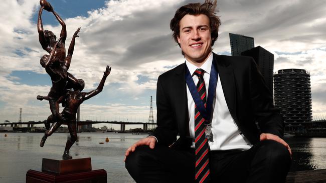 Andrew McGrath with the AFL Rising Star trophy and Ron Evans Medal.