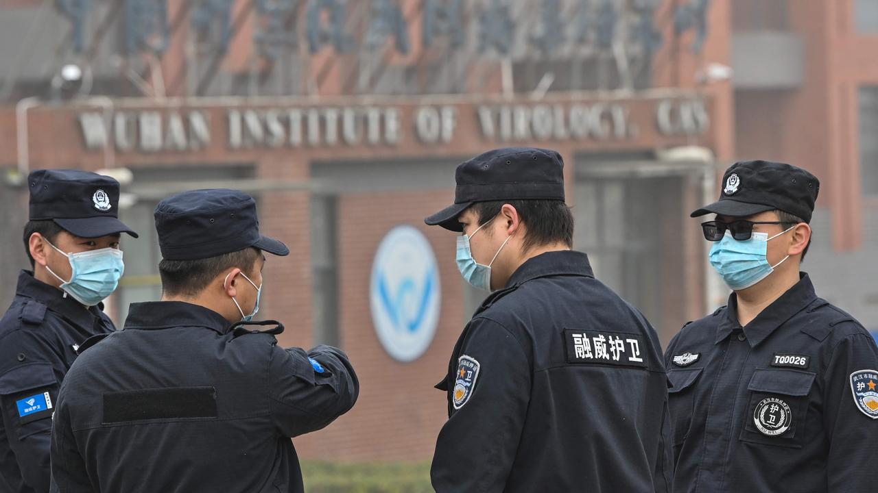 Security personnel stand guard outside the Wuhan Institute of Virology in Wuhan. Picture: Hector Retamal/AFP