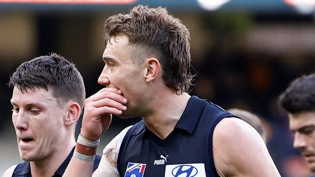 MELBOURNE, AUSTRALIA - AUGUST 11: Patrick Cripps of the Blues (right) looks dejected after a loss during the 2024 AFL Round 22 match between the Carlton Blues and the Hawthorn Hawks at The Melbourne Cricket Ground on August 11, 2024 in Melbourne, Australia. (Photo by Michael Willson/AFL Photos via Getty Images)