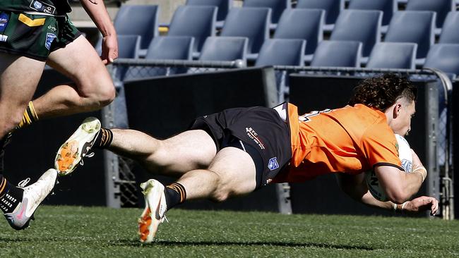 Tigers fullback Jake Ennis dives over for a try. Picture: John Appleyard