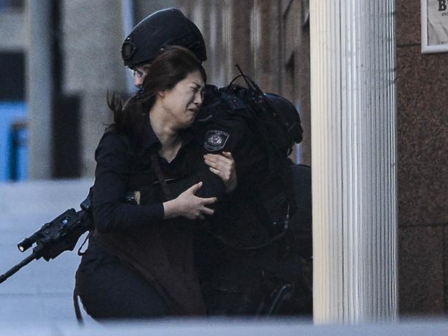 Police attend a siege in the Lindt shop in Sydney's Martin Place. Photos: Chris McKeen