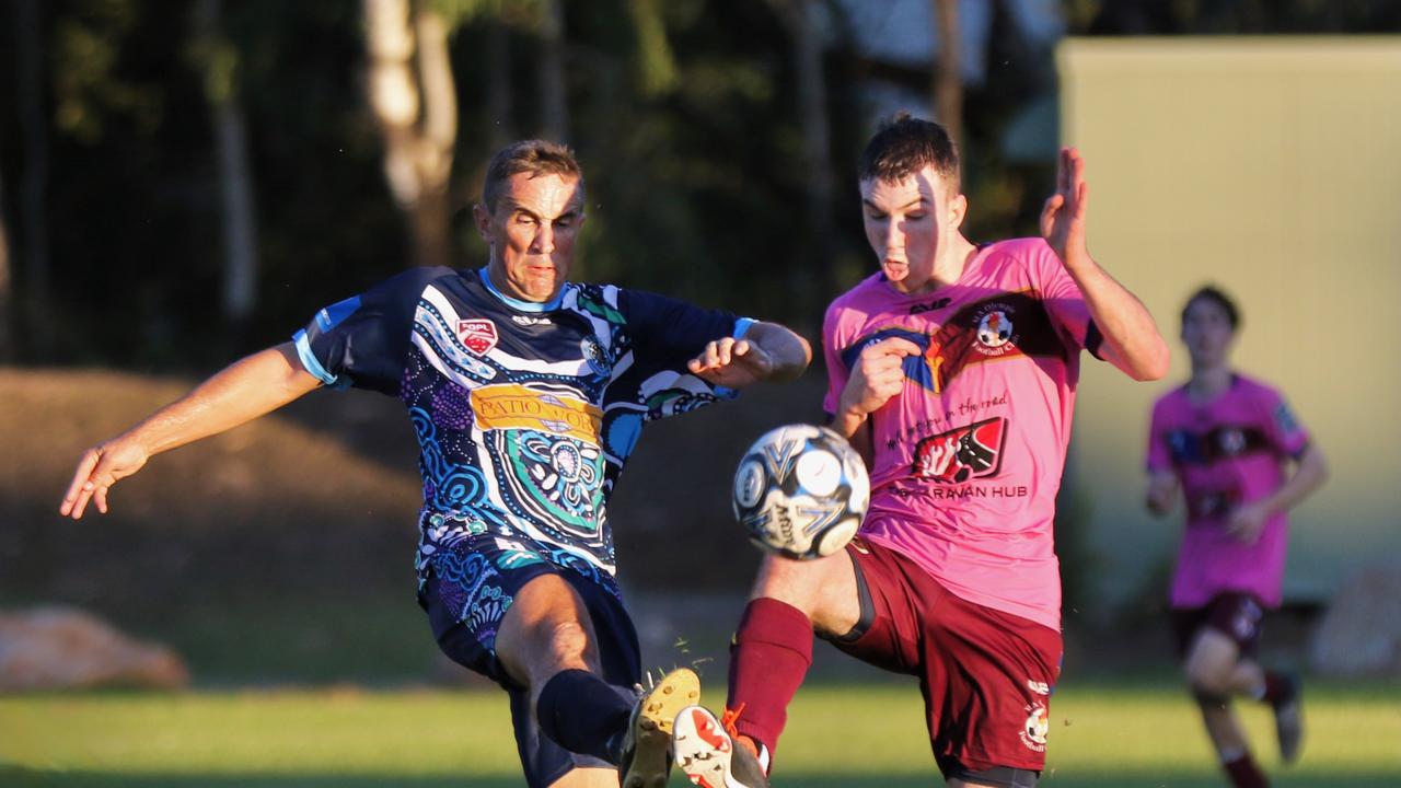 Action between Estates FC and MA Olympic.