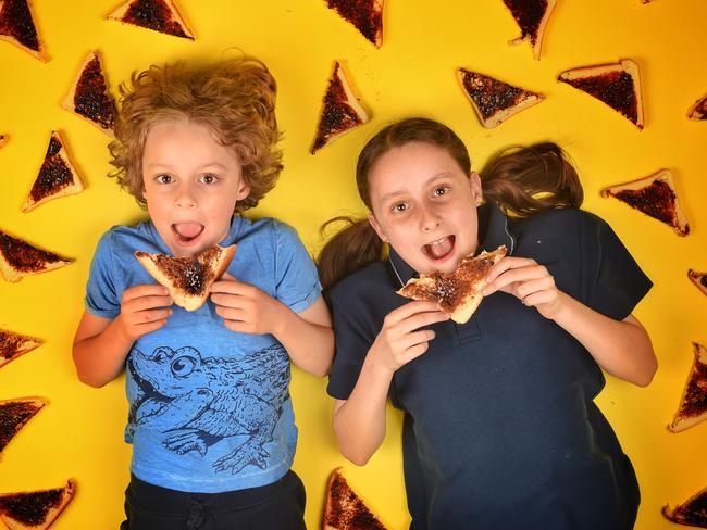 Hamish and Lila Simpson taste test the new Vegemite. Picture: Tony Gough