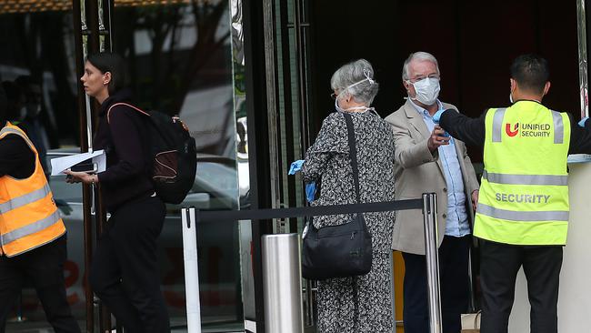 Travellers are released from the Crown Promenade Hotel in May. Picture : Ian Currie