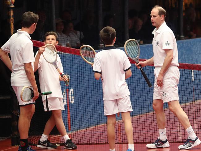 Prince Edward, right, with junior players, from left, ick Stenning, 17, Ronan Pritchard, 13, and Oliver Pridmore, 13, at the Hobart Real Tennis Club. Pictures: NIKKI DAVIS-JONES