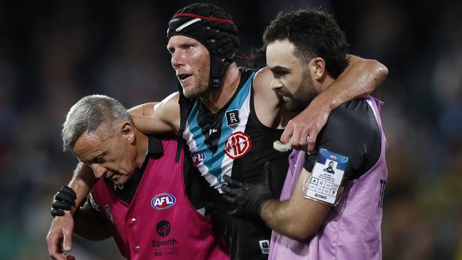 Brad Ebert of the Power is taken from the ground after suffering a concussion during a match on October 16, 2020. Picture: Ryan Pierse/Getty Images