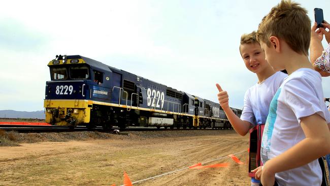 Kyle, 11 and his brother Cody, 7, watch the coal train pass Harris Street, Stirling North, where their grandmother, Kay Reinertsten, has lived for 33 years. Picture: Dean Martin