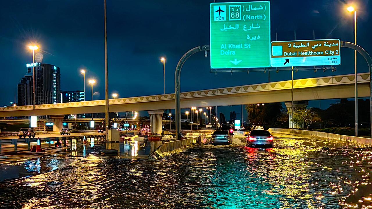 Motorists drive along a flooded street following heavy rains in Dubai. Picture: Giuseppe CACACE/AFP