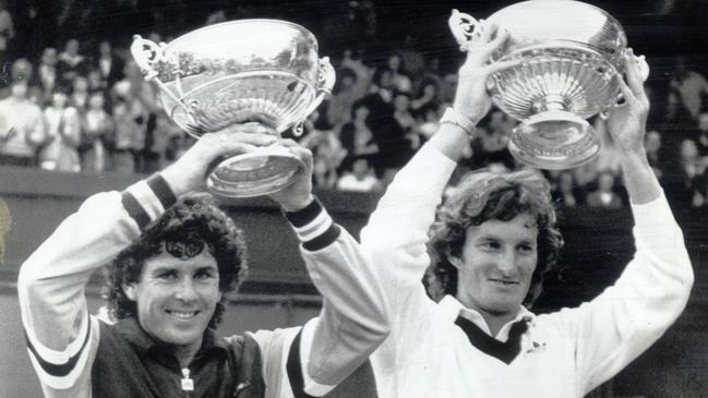 Paul McNamee (left) and Peter McNamara hold their 1980 Wimbledon doubles trophies aloft in 1980. Picture: Supplied