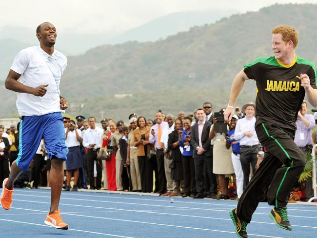 Letting Prince Harry get the best of him in 2012. Picture: AP/John Stillwell/PA)