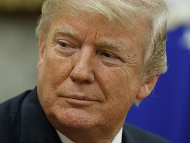 FILE - In this Jan. 10, 2018, file photo, President Donald Trump listens during a meeting in the Oval Office of the White House, in Washington. Casting a cloud over already tenuous negotiations, President Donald Trump said Sunday, Jan. 14, that Deferred Action for Childhood Arrivals program, or DACA, a program that protects immigrants who were brought to the U.S. as children and live here illegally is â€œprobably deadâ€ and blamed Democrats, days before some government functions would start shutting down unless a deal is reached. (AP Photo/Evan Vucci, File)